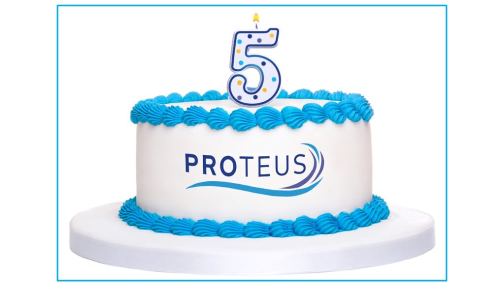 PROTEUS birthday cake with a number 5 candle on it